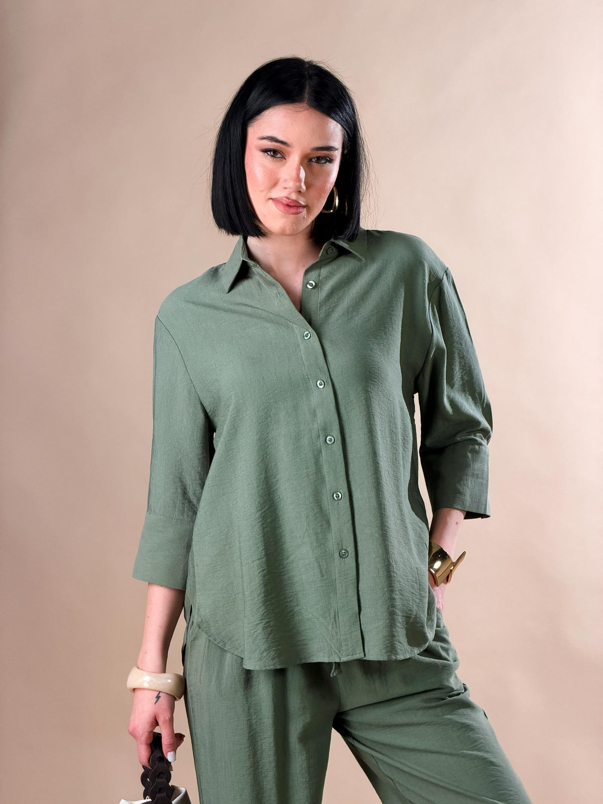 Celeste — Camisa con botones y mangas tres cuartos