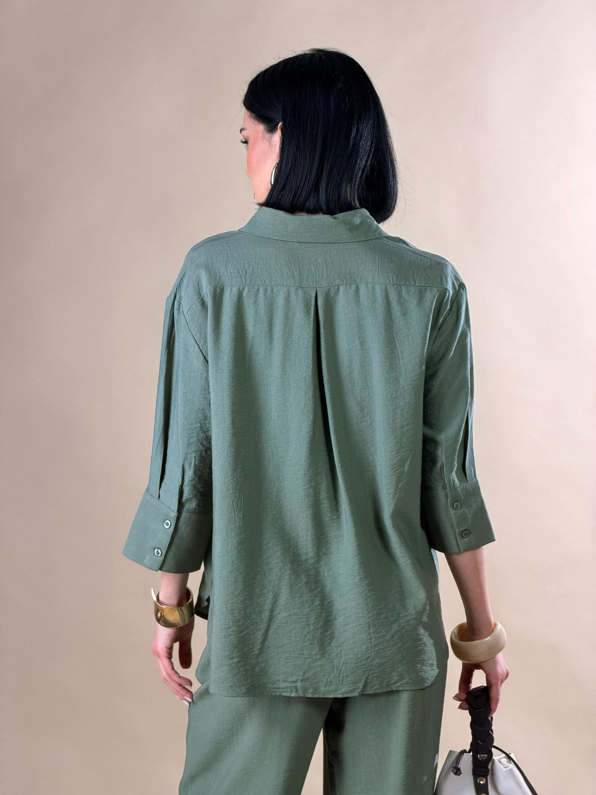 Celeste — Camisa con botones y mangas tres cuartos