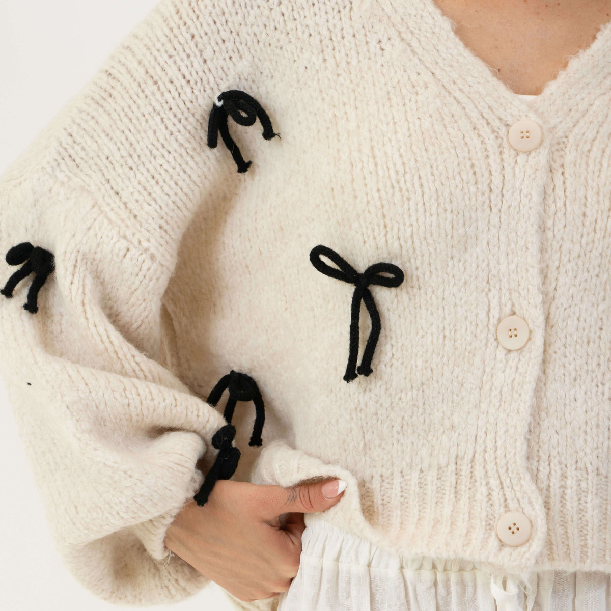 Aroa — Cárdigan holgado con mini lazos