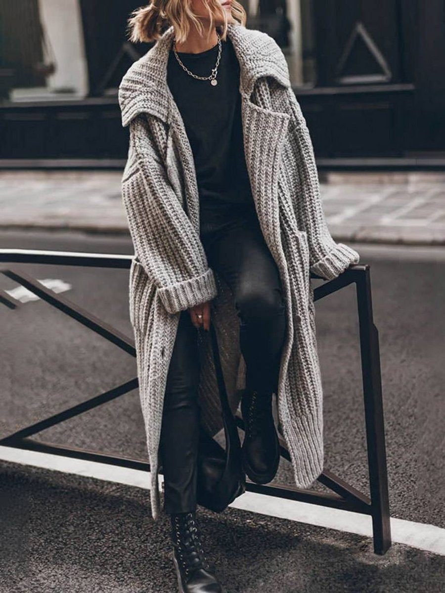 Ysabel — Jersey de punto largo oversized con cuello solapa y bolsillos