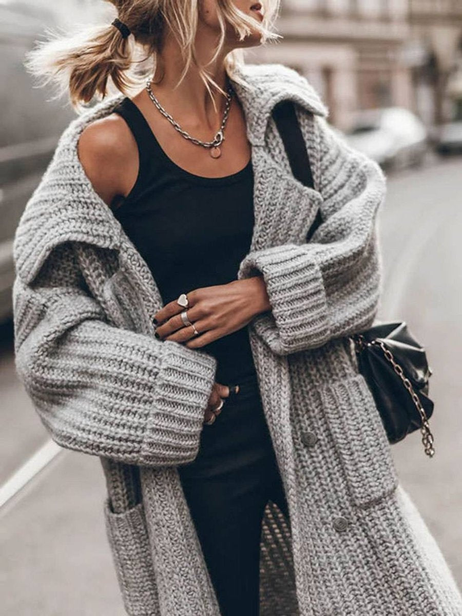 Ysabel — Jersey de punto largo oversized con cuello solapa y bolsillos