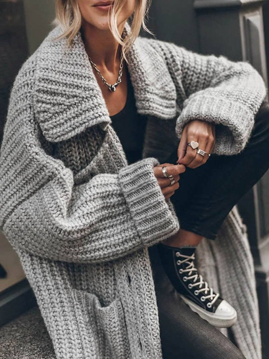 Ysabel — Jersey de punto largo oversized con cuello solapa y bolsillos