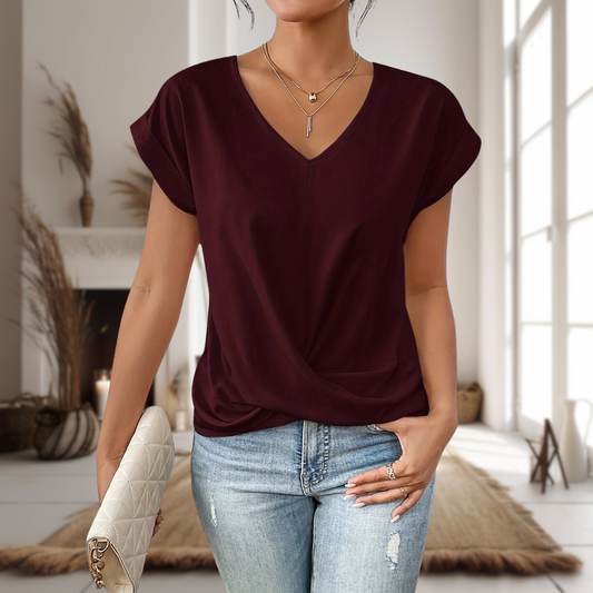 Maia — Blusa de manga corta con cuello en V y dobladillo cruzado
