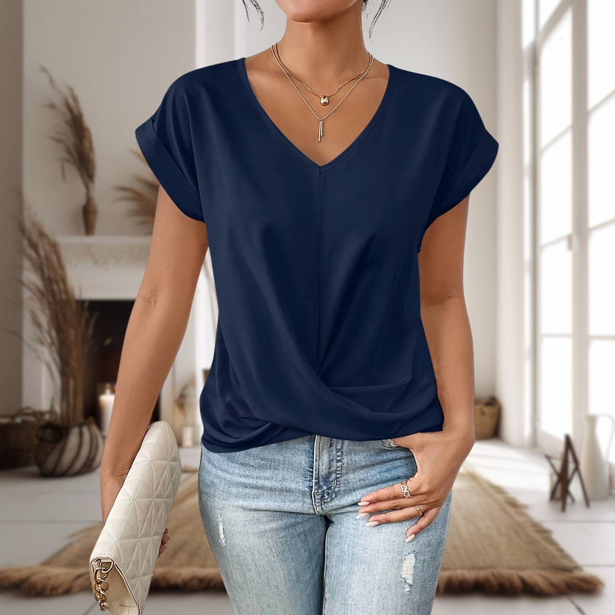 Maia — Blusa de manga corta con cuello en V y dobladillo cruzado